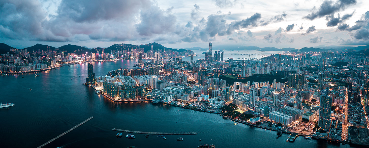 aerial view of a cloudy hong kong at dusk