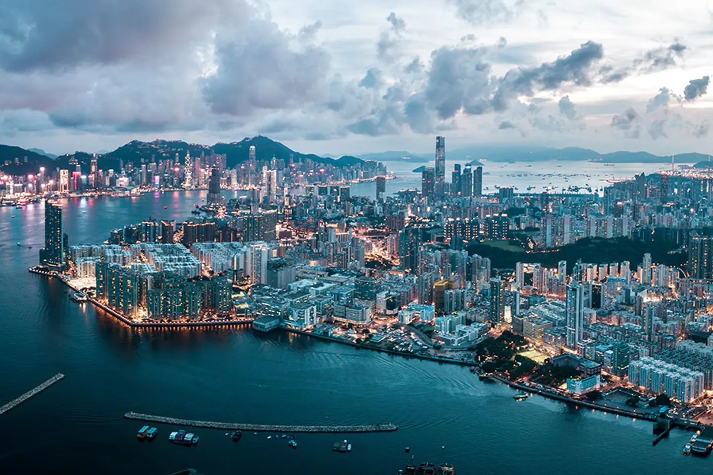 aerial view of a cloudy hong kong at dusk