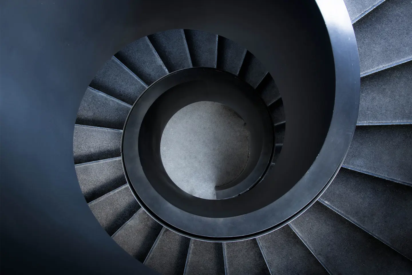 aerial view of dark metal spiral staircase