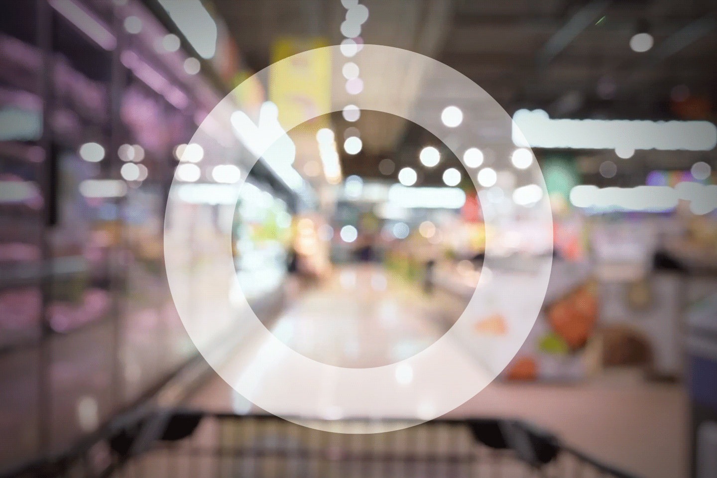 Trolley in supermarket aisle from the point of view of the shopper