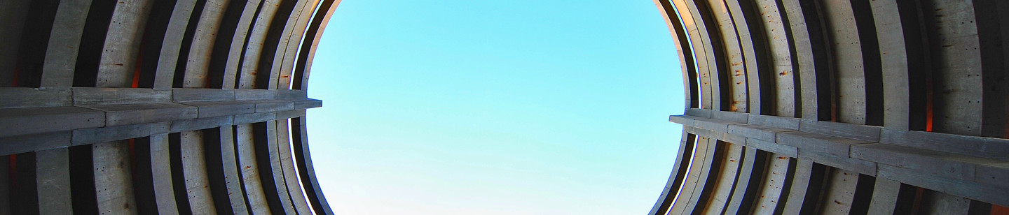 Metal tunnel pointing towards sky