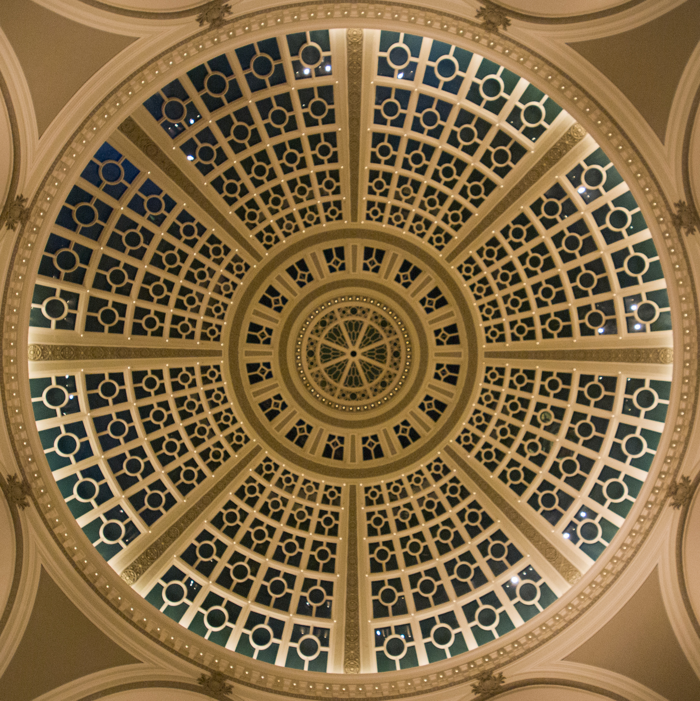 Intricately designed skylight in ceiling of dome shaped building 