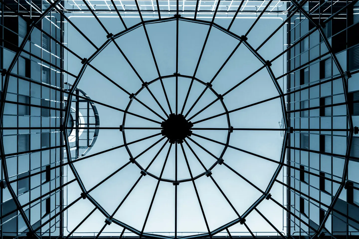 ground view of buildings with metal grate overlayed