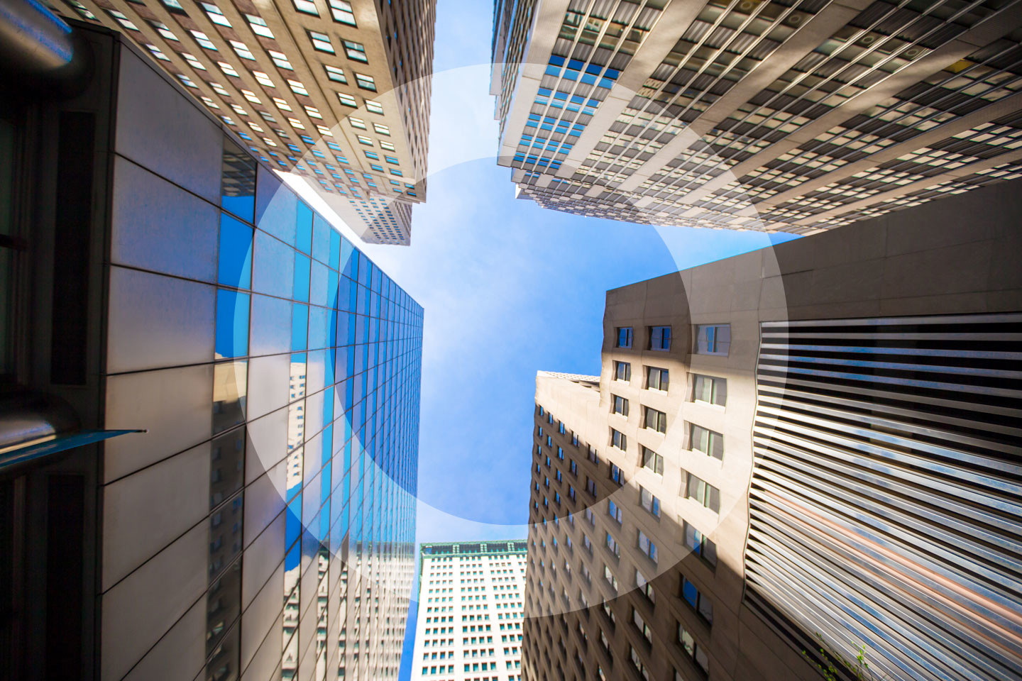 Looking Up At Modern Buildings Amd Blue Sky