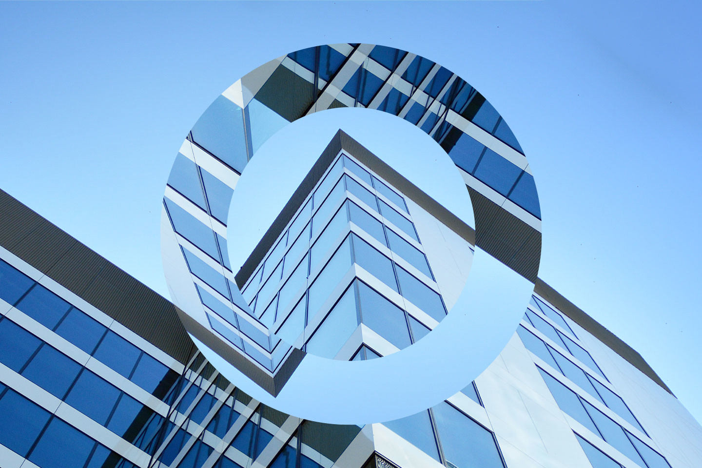 blue highrise building with O overlay
