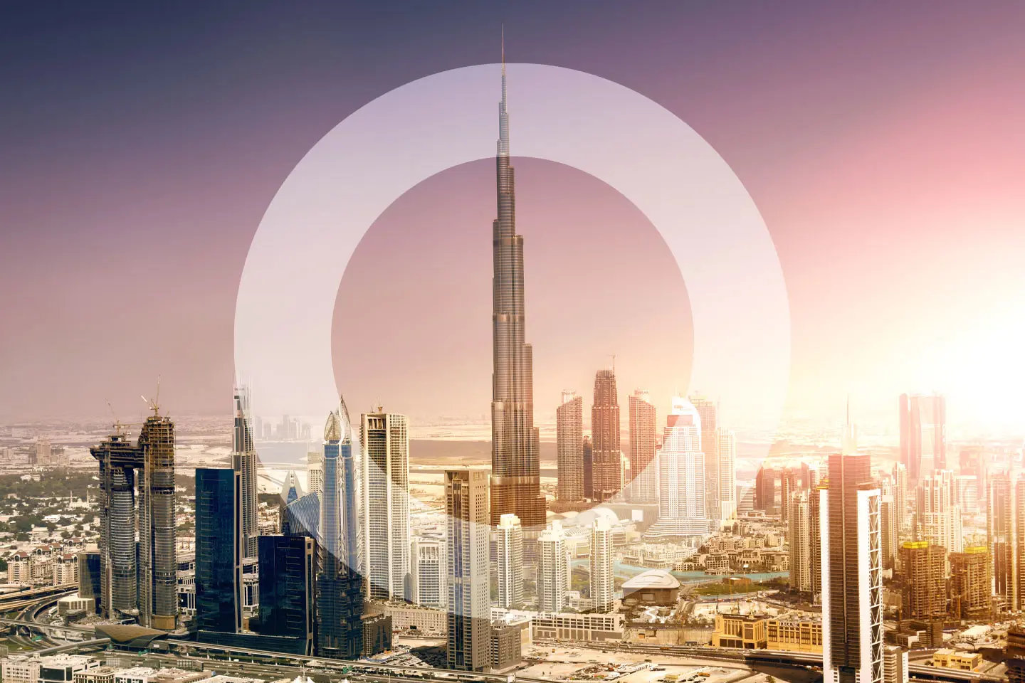 Dubai skyline at dusk with overlayed 'O'