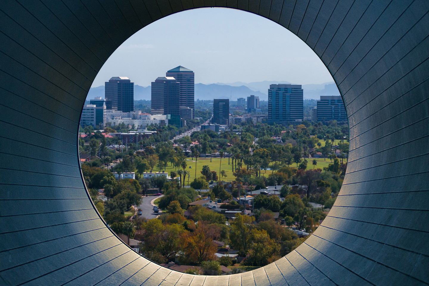 city captured through constructed tube